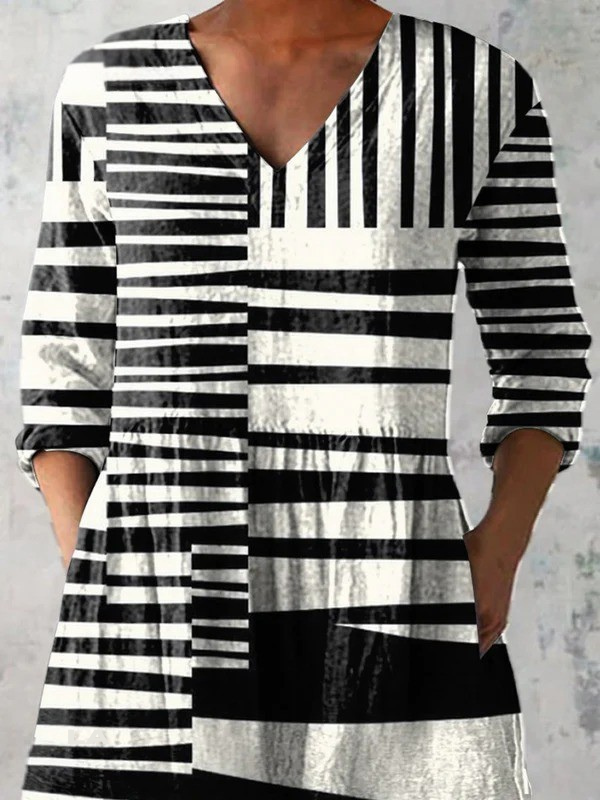 Capri – Blusa larga con escote en V, tela fluida para un look sofisticado