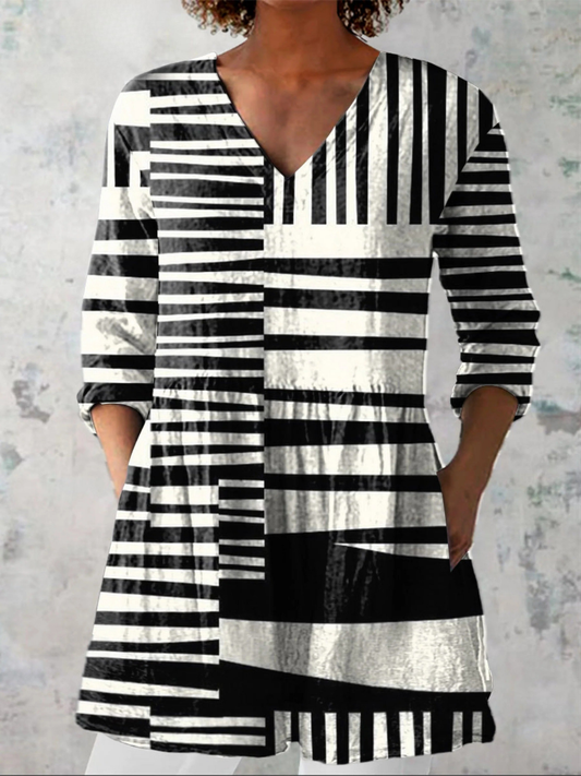 Capri – Blusa larga con escote en V, tela fluida para un look sofisticado